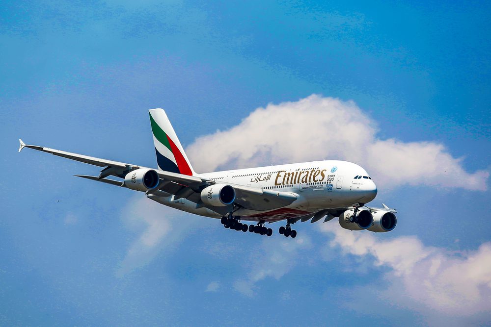 Emirates Airplane flying in a blue sky
